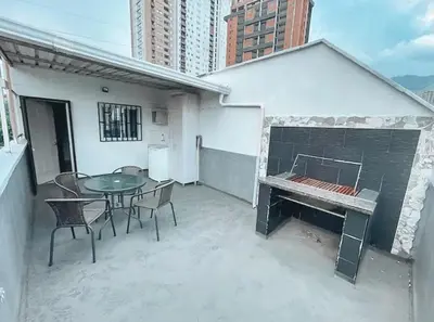 a patio with a table and chairs and a fireplace at Beautiful Duplex Apt in Cabañas Bello Antioquia in Medellín