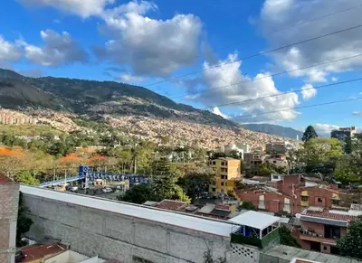 a view of a city with mountains in the background at Beautiful Duplex Apt in Cabañas Bello Antioquia in Medellín