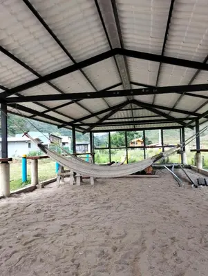 a large tent with a hammock inside of it at Centro Turístico Paraíso del Nare in Alejandría