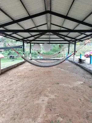 a hammock in a pavilion with a tent at Centro Turístico Paraíso del Nare in Alejandría