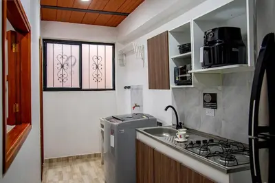 a small kitchen with a sink and a stove at Apartamento clásico Riosucio in Ruiosucio