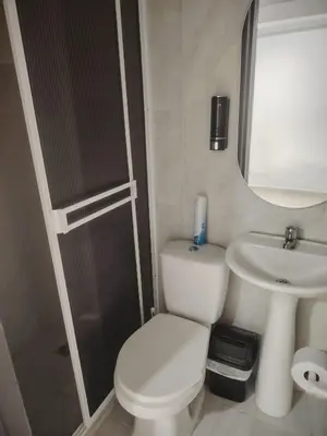 a small bathroom with a toilet and a sink at Apartaestudio Amoblado Chinchina Caldas in Chinchiná