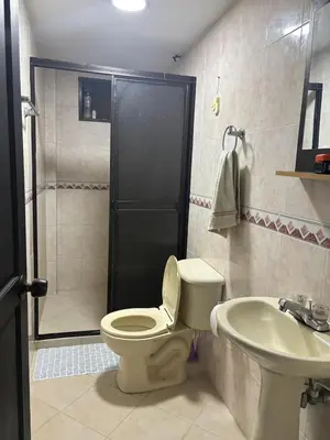 a bathroom with a toilet and a sink at Hospedaje Doña Blanca 3 in Envigado