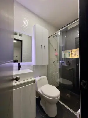 a bathroom with a toilet and a sink and a shower at Comfortable House in Mariquita