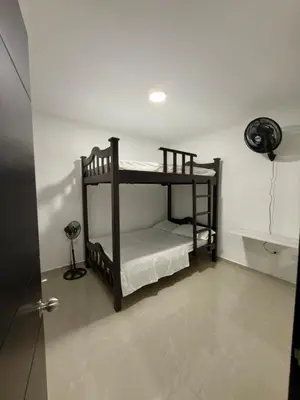 a room with two bunk beds in a room at Comfortable House in Mariquita