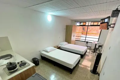 a hospital room with two beds and a sink at Edificio Casa Anita in Medellín