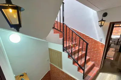 a spiral staircase with a brick stair case at Edificio Casa Anita in Medellín
