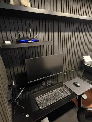 a desk with a computer monitor and a keyboard and mouse at Modern Apt in Poblado with Private Terrace & Gym in Medellín