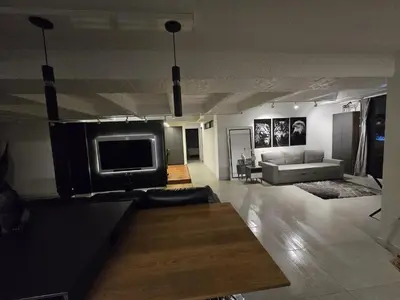 a living room with a couch and a flat screen tv at Modern Apt in Poblado with Private Terrace & Gym in Medellín