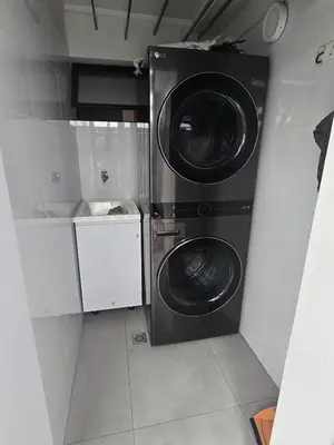 a utility room with two washing machines in it at Modern Apt in Poblado with Private Terrace & Gym in Medellín