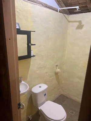 a bathroom with a toilet and a sink at Cabaña vip familiar vista verde in Cocorná