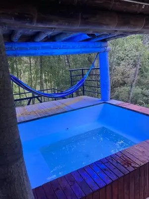 a plunge pool on the deck of a tree house at Cabaña vip familiar vista verde in Cocorná
