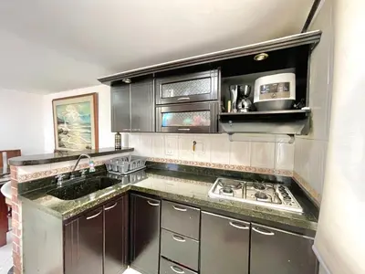 a kitchen with stainless steel cabinets and a stove at medellín palmas sandiego 2 in Medellín