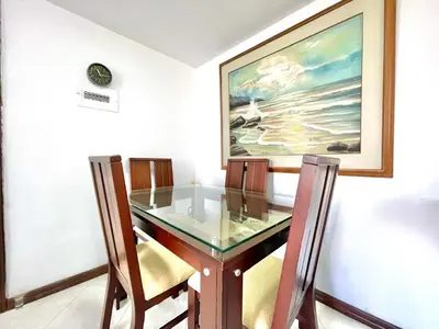 a dining room with a glass table and chairs at medellín palmas sandiego 2 in Medellín