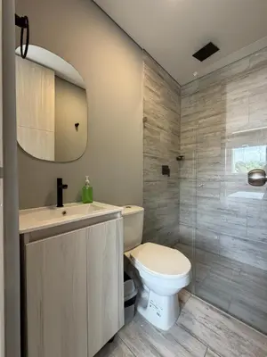 a bathroom with a toilet and a sink at Apto Citadela Di Sole in Santa Fe de Antioquia