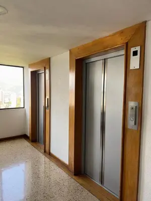 a corridor of an office building with glass doors at Penthouse Rio Claro 1002 in Medellín