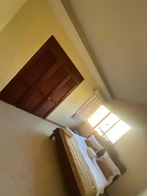 a bedroom with a bed and a window at Penthouse Rio Claro 1002 in Medellín