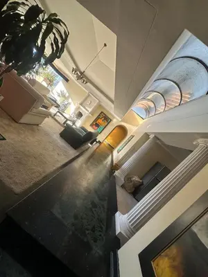 a view of a living room with a cat laying on the floor at Penthouse Rio Claro 1002 in Medellín