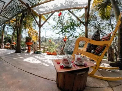 a chair sitting on a table under a gazebo at Almaia 17 in Rionegro
