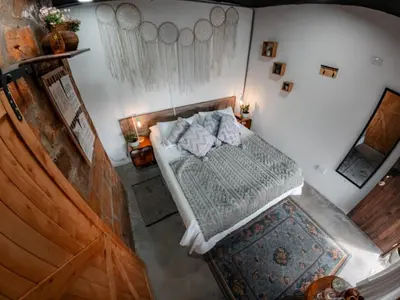 an overhead view of a bedroom with a bed at Almaia 17 in Rionegro