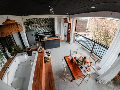 an aerial view of a kitchen and dining room with a table at Almaia 17 in Rionegro
