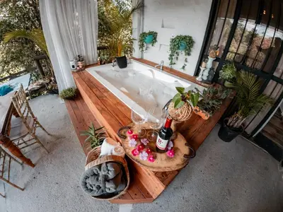 an overhead view of a bath tub with a bottle of champagne at Almaia 17 in Rionegro