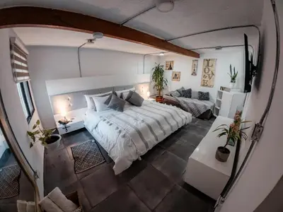 an overhead view of a bedroom with a bed and a couch at Almaia 17 in Rionegro
