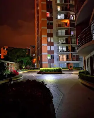 an empty parking lot in a city at night at Apartment near Atanasio Girardot Stadium in Medellín