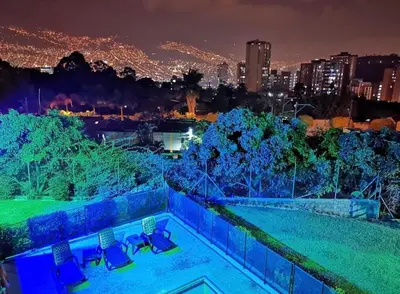 a view of a city at night at Apartment near Atanasio Girardot Stadium in Medellín