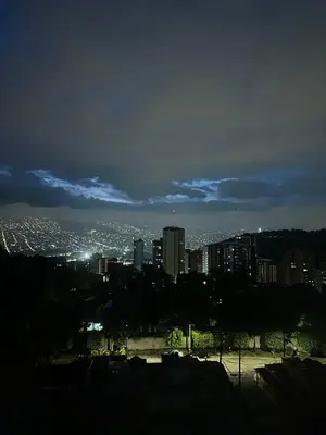 a view of a city at night at Apartamento cerca del estadio de Medellín in Medellín