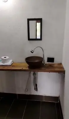 a bathroom with a wooden counter with a sink at Refugio de Sueños in San Rafael