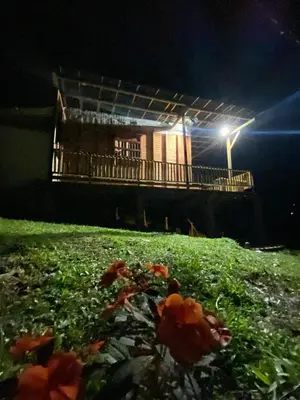 a field of grass with a building with a street light at Refugio de Sueños in San Rafael