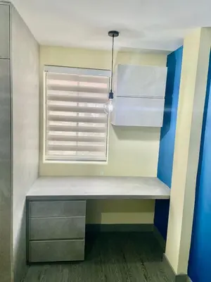 a bench in a room with a window at Smart apartment in Bello