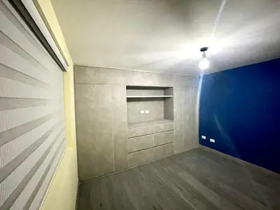an empty room with a light on the ceiling at Smart apartment in Bello