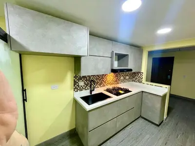 a small kitchen with a sink and a stove at Smart apartment in Bello