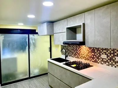 a kitchen with a sink and a stove in it at Smart apartment in Bello