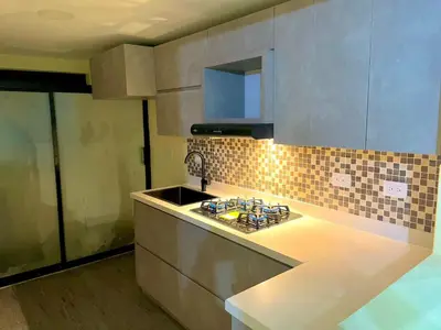 a kitchen with a sink and a counter top at Smart apartment in Bello