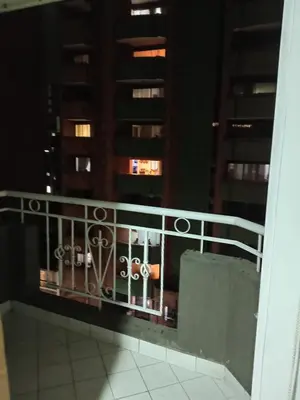 a balcony with a view of a building at Apartahabitacion Laureles in Medellín