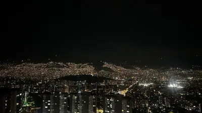 an aerial view of a city at night at Elena house in Medellín