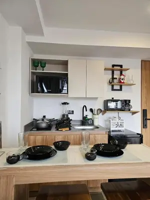 a kitchen with a counter with black bowls on it at Inner Bloom in Medellín