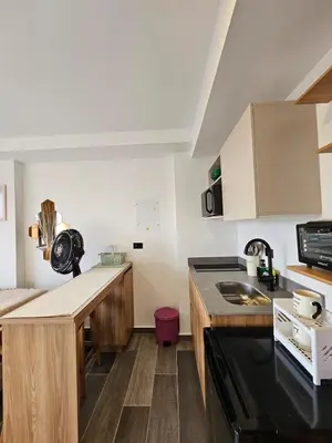 a kitchen with a sink and a counter top at Inner Bloom in Medellín