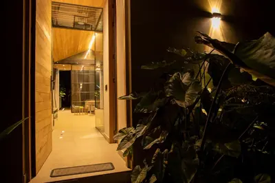 a door leading to a hallway with a plant at Selvva suites cabaña de lujo romántica con jacuzzi in Rionegro