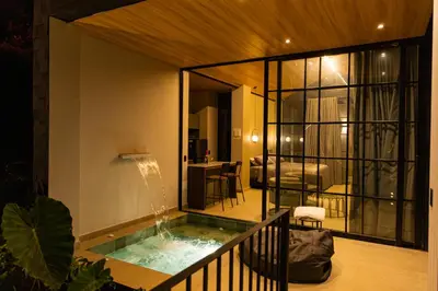 a house with a pool in the middle of a room at Selvva suites cabaña de lujo romántica con jacuzzi in Rionegro