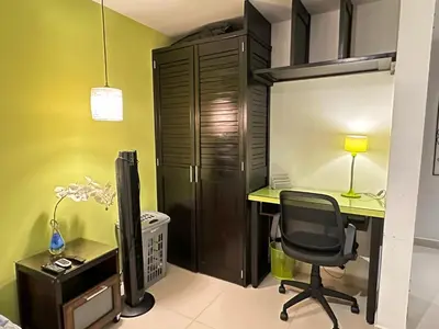 an office with a desk and a chair at Apartamento familiar en el Poblado Medellín in Medellín