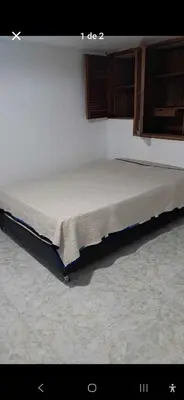a bed frame in a room with at Habitación laureles in Medellín