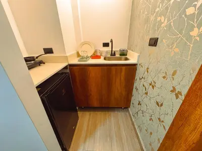 a small kitchen with a sink and a counter at Apartaestudios Zeni in Medellín