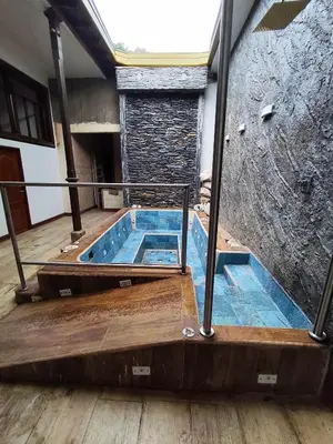 a hot tub in the middle of a building at Casa Epoca Dorada in Medellín