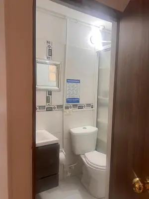 a bathroom with a toilet and a sink at Apartamento Buenos Aires in Medellín