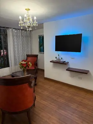 a waiting room with a flat screen tv on a wall at Apartamento céntrico y acogedor in Medellín