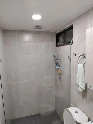 a bathroom with a toilet and a shower at Habitación en Medellín in Medellín